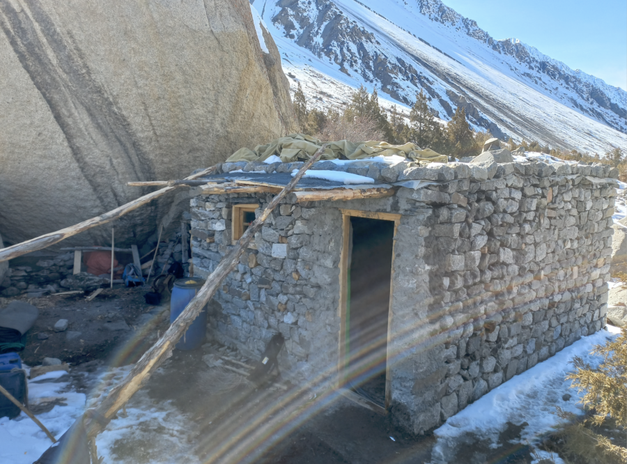 Batura glacier higher camp under massive rock