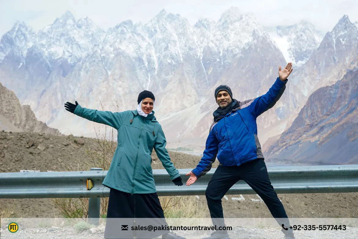 Couple posing infront of Passu Cones, a must visit place in Hunza Valley 