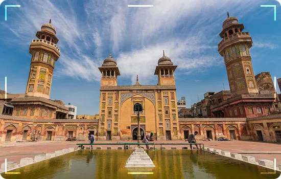 Wazir Khan Mosque Walled City: intricate colorful tilework and historic Mughal arches on our guided Lahore city tours