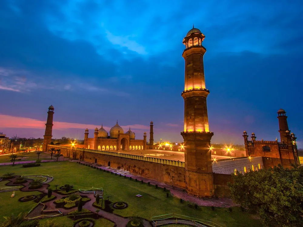 Grand red sandstone courtyard architecture viewed on a Badshahi Mosque Guided Tour