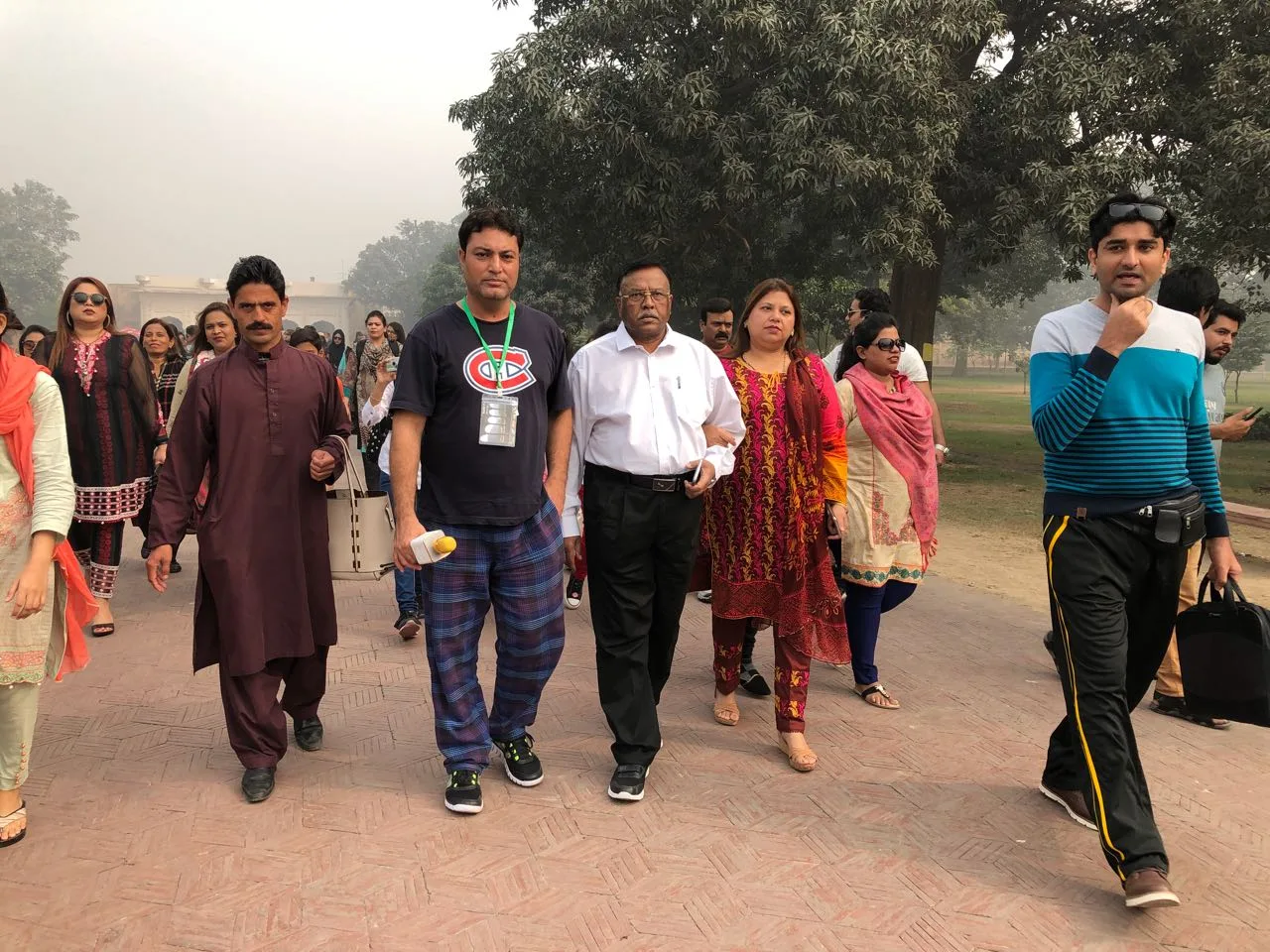 Happy travelers posing during a guided group Lahore Fort Shahi Qila Tour