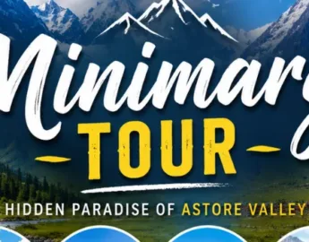 Scenic view of Minimarg Valley with snow-capped mountains, lush green meadows, wooden cottages - Book Minimarg Tour now