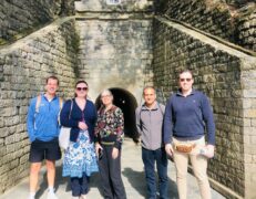 Ayubia Motto Tunnel Full View Foreign Tourists Full scenic view of the historic British-era Motto Tunnel in Ayubia featuring international tourists during a Murree tour by Pakistan Tour & Travel