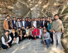 Ayubia Motto Tunnel Group Tour Murree Group of local tourists standing in front of the historic Motto Tunnel in Ayubia during a Galyat tour by Pakistan Tour & Travel