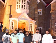 Tourists posing in front of the historic British-era GPO building on Mall Road Murree during a package tour by Pakistan Tour & Travel