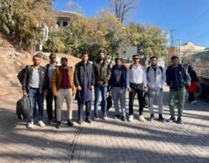 Murree City Road Group Tourists Group of tourists standing on a city road during a Murree sightseeing tour package by Pakistan Tour & Travel