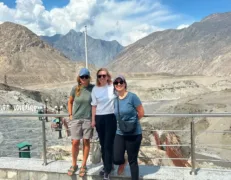 Confluence of 3 Great Mountain Ranges Travelers at the confluence point where the Himalayas, Karakoram, and Hindu Kush ranges meet