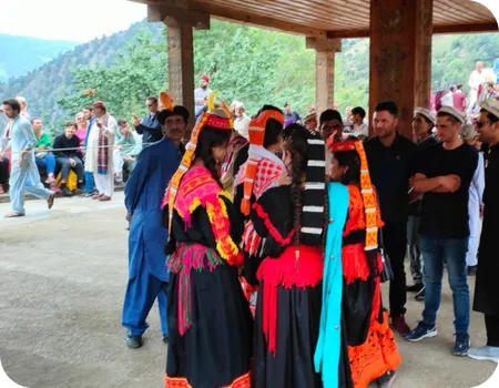 Kalashi girls and boy preparing for traditional dance Girls and boys preparing for Uchal Festival Tour