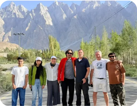 Tourist in Hunza valley for silk route tour where passu cones are in background