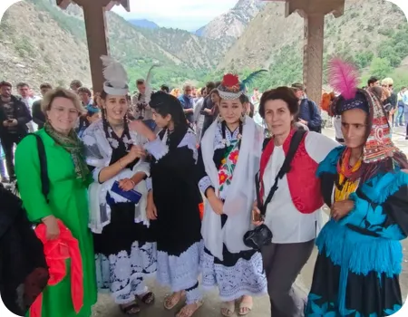 Uchal Festival celebration Tourist with kalashi girl on Uchal Festival Tour - book your tour now