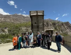 Tour group gathering for a snapshot before the 900-year-old wooden watchtower at Altit Fort