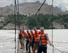 Hussaini Rope Bridge Adventure Family wearing safety life vests for the Hussaini Suspension Bridge river crossing
