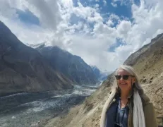 Joyful Tourist at Hopper Glacier Nagar Valley Joyful foreign woman posing with a smiling face close-up at Hopper Glacier in Hoper Village