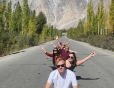 Scenic Drive on Karakoram Highway Paved stretch of Karakoram Highway framing the iconic Passu Cones mountain scenery