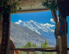 Rakaposhi Mountain View from Hotel Room Scenic view of snow-capped Rakaposhi Mountain peak seen from a hotel room window in Hunza Valley