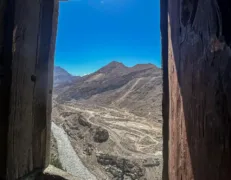 Scenic View from Altit Fort Window Hunza Panoramic view of Hunza River and valley landscape seen through an Altit Fort window