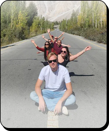 Family Tour Packages Northern Pakistan Family travelers exploring Passu Cones in Hunza Valley during a holiday tour