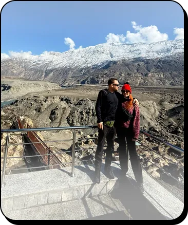 Honeymoon Tour Packages Pakistan Honeymoon couple enjoying a scenic mountain view during a Northern Pakistan tour